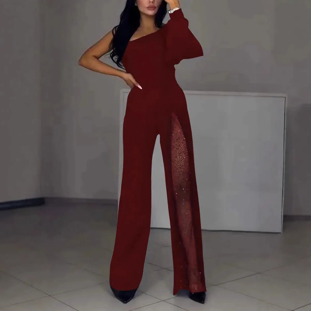 Women's black polyester jumpsuit with oblique shoulder neckline and high slit leg detailing