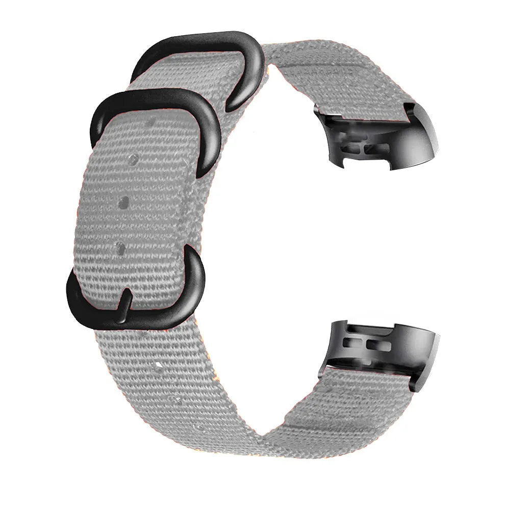 Nylon three-ring buckle replacement strap for Fitbit Charge fitness tracker in multiple colours.