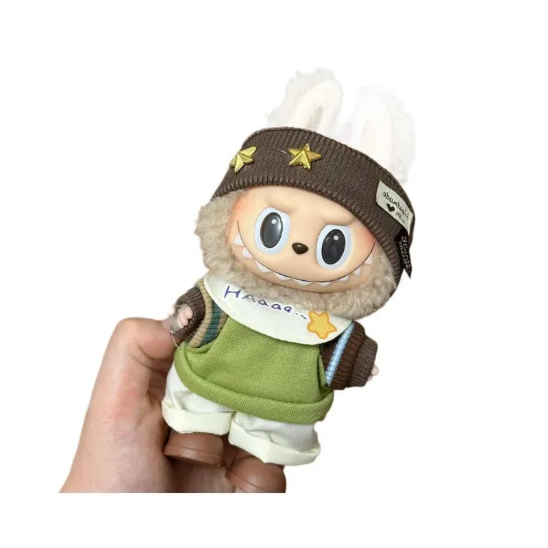 Plastic doll clothing costume for 17cm tall vinyl figurines on a display stand.