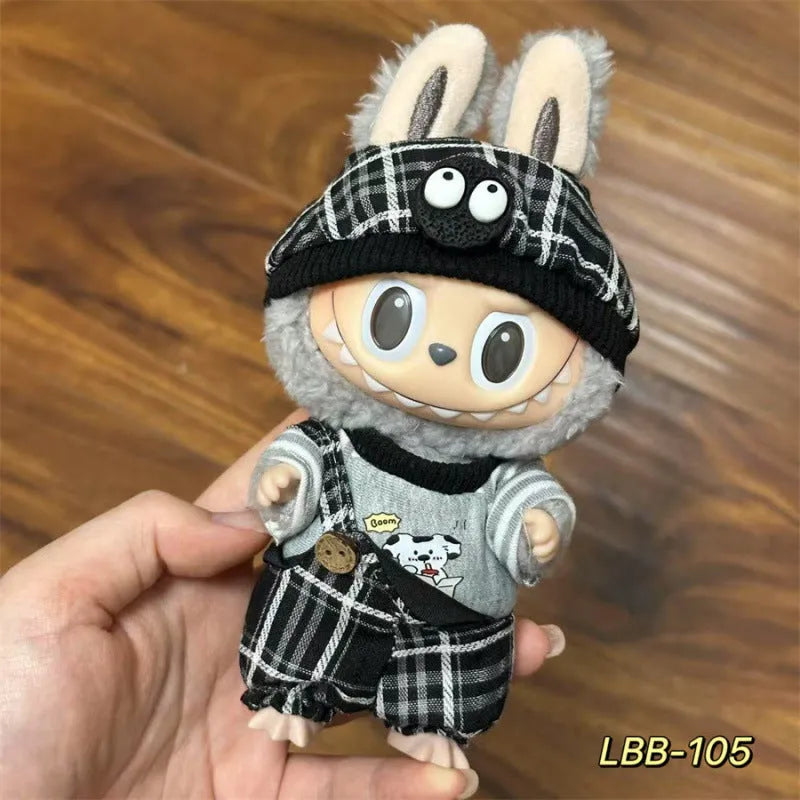 Plastic doll clothing costume for 17cm tall vinyl figurines on a display stand.