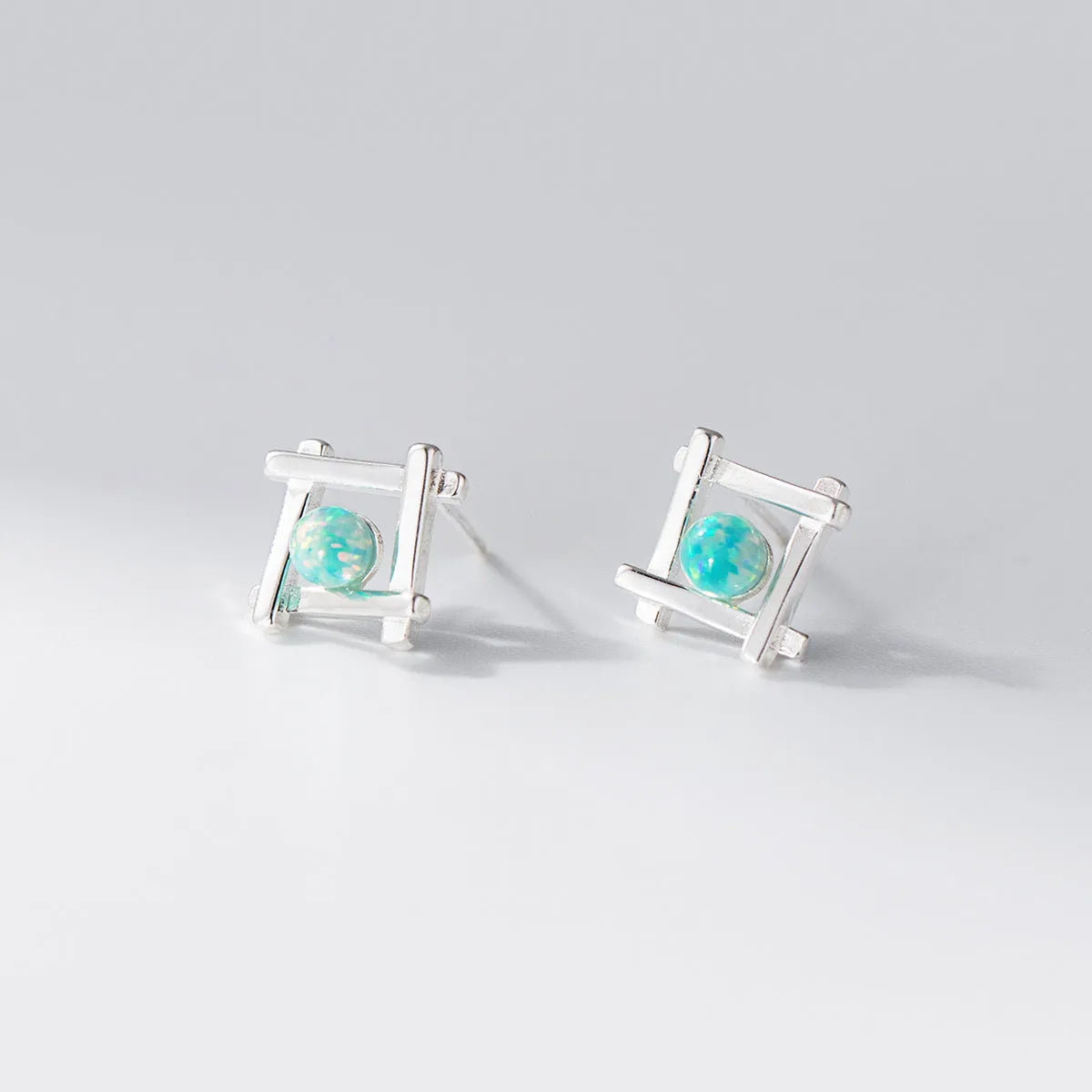 Geometric cross quadrangle stud earrings in 925 sterling silver with Seiko treatment