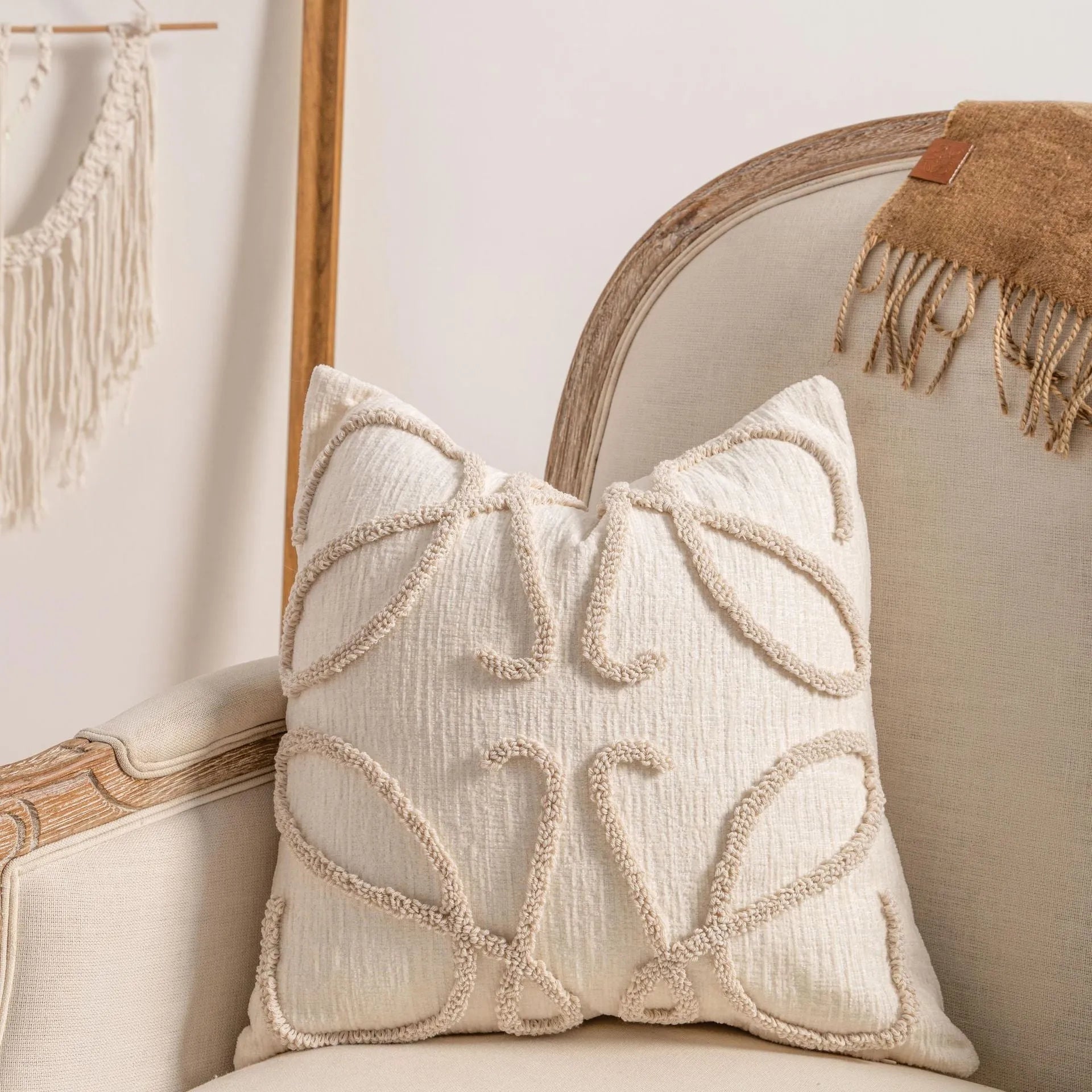 Knitted sofa cushion cover with tassel detail and striped pattern in spiral dots colour design