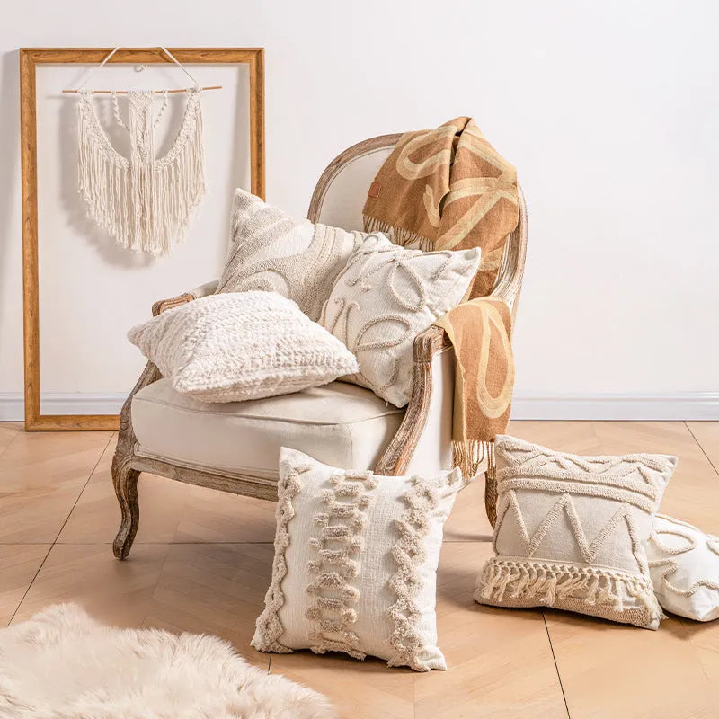 Knitted sofa cushion cover with tassel detail and striped pattern in spiral dots colour design