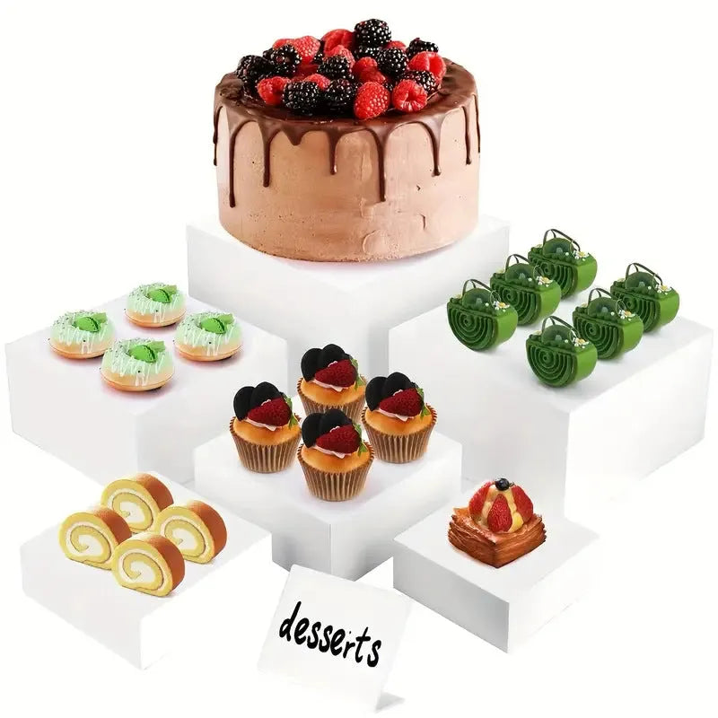 White plastic six-piece stacking dessert table display stand set for tiered bakery presentation