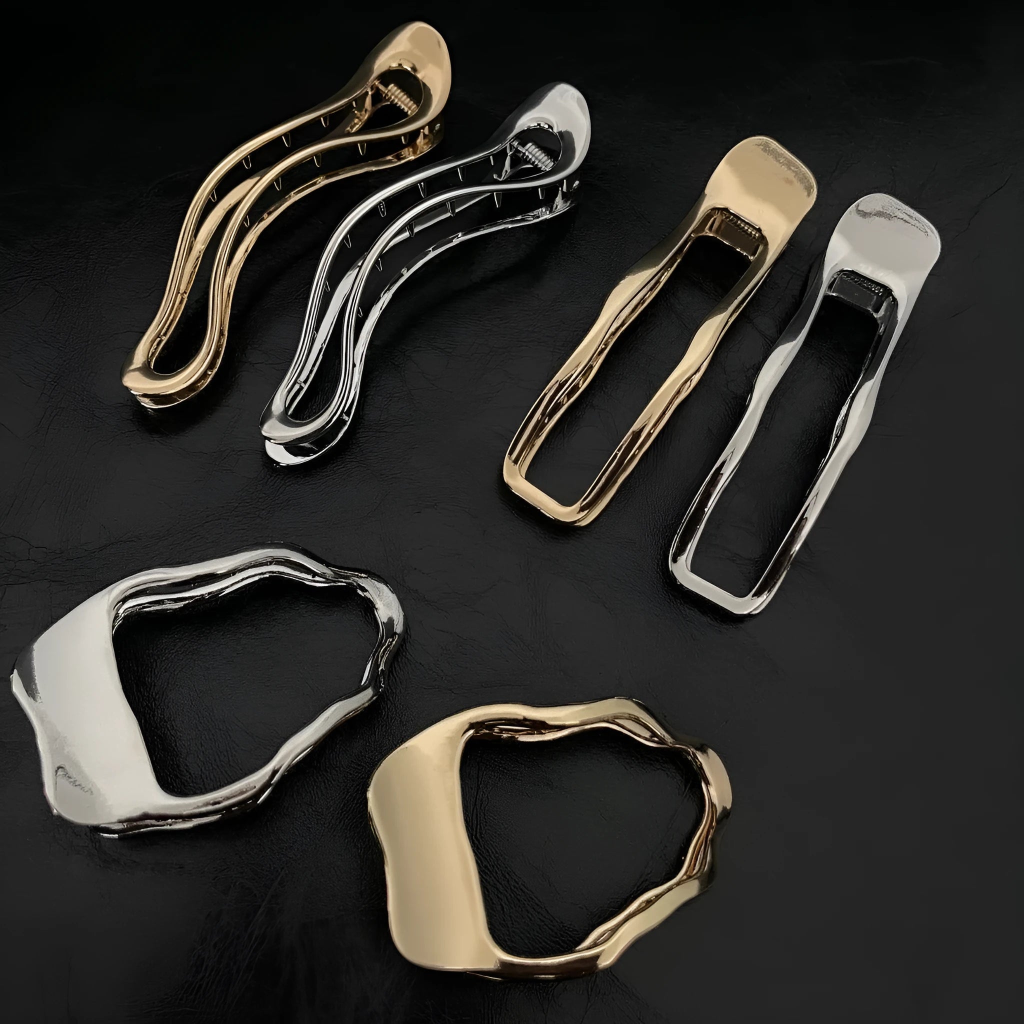 Golden zinc alloy hair barrette in an arc shape on a white background
