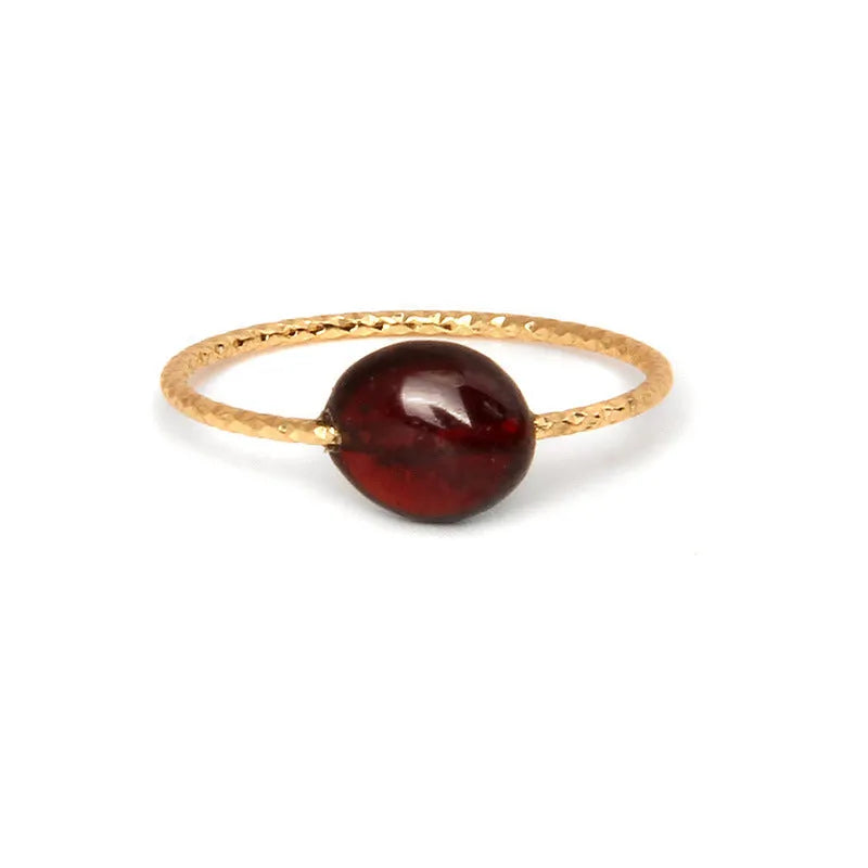 Original geometric women's agate ring on a hand, showing unique stone banding in one of eight colour options.