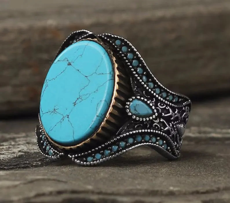 Men's round turquoise alloy ring with antique silver finish showing UK size markings