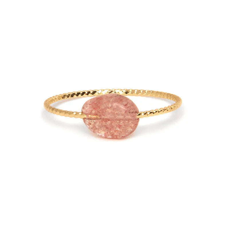 Original geometric women's agate ring on a hand, showing unique stone banding in one of eight colour options.