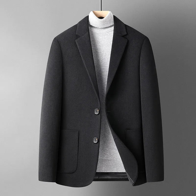 Men's slim-fit wool suit jacket in grey, shown on a hanger.
