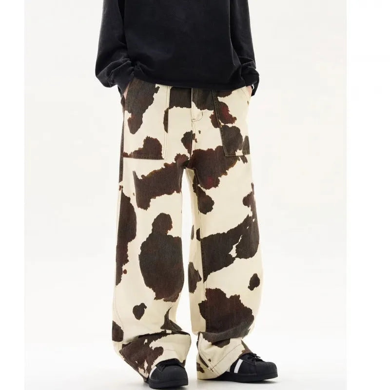 Men's straight-leg casual trousers with a retro-style cows print pattern on a cotton-polyester fabric.