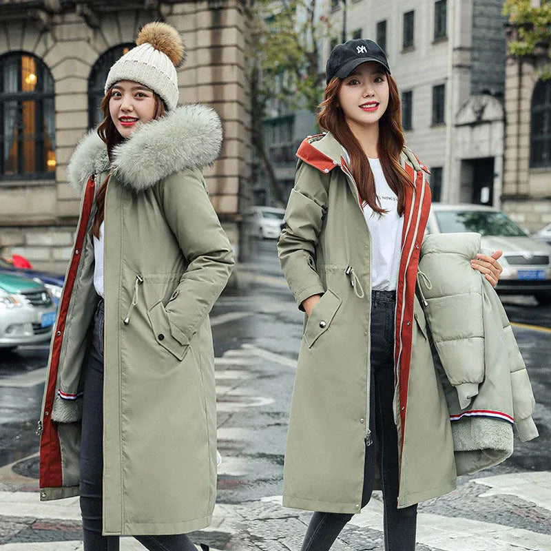 Women's long beige trench coat with a two-way zip, shown on a model.