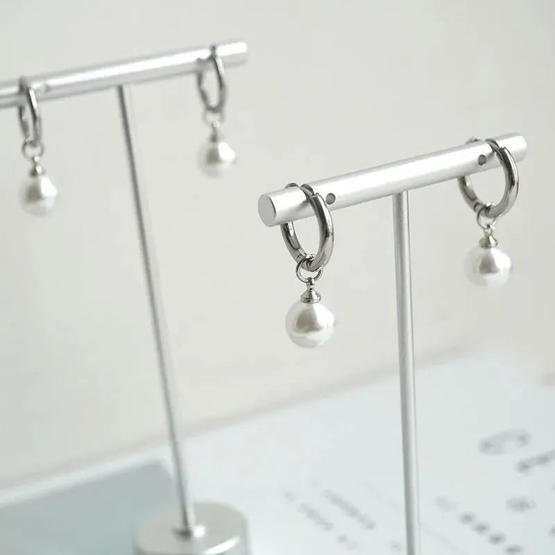 Pearl drop earrings with geometric alloy shape and titanium steel posts
