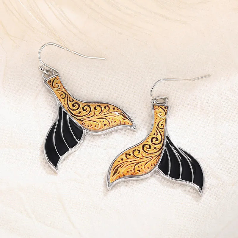 Women's white gold colour fishtail earrings with whale design