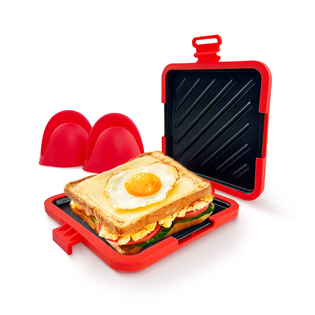 Red silicone baking tray with hand clamp attachment showing anti-scald design