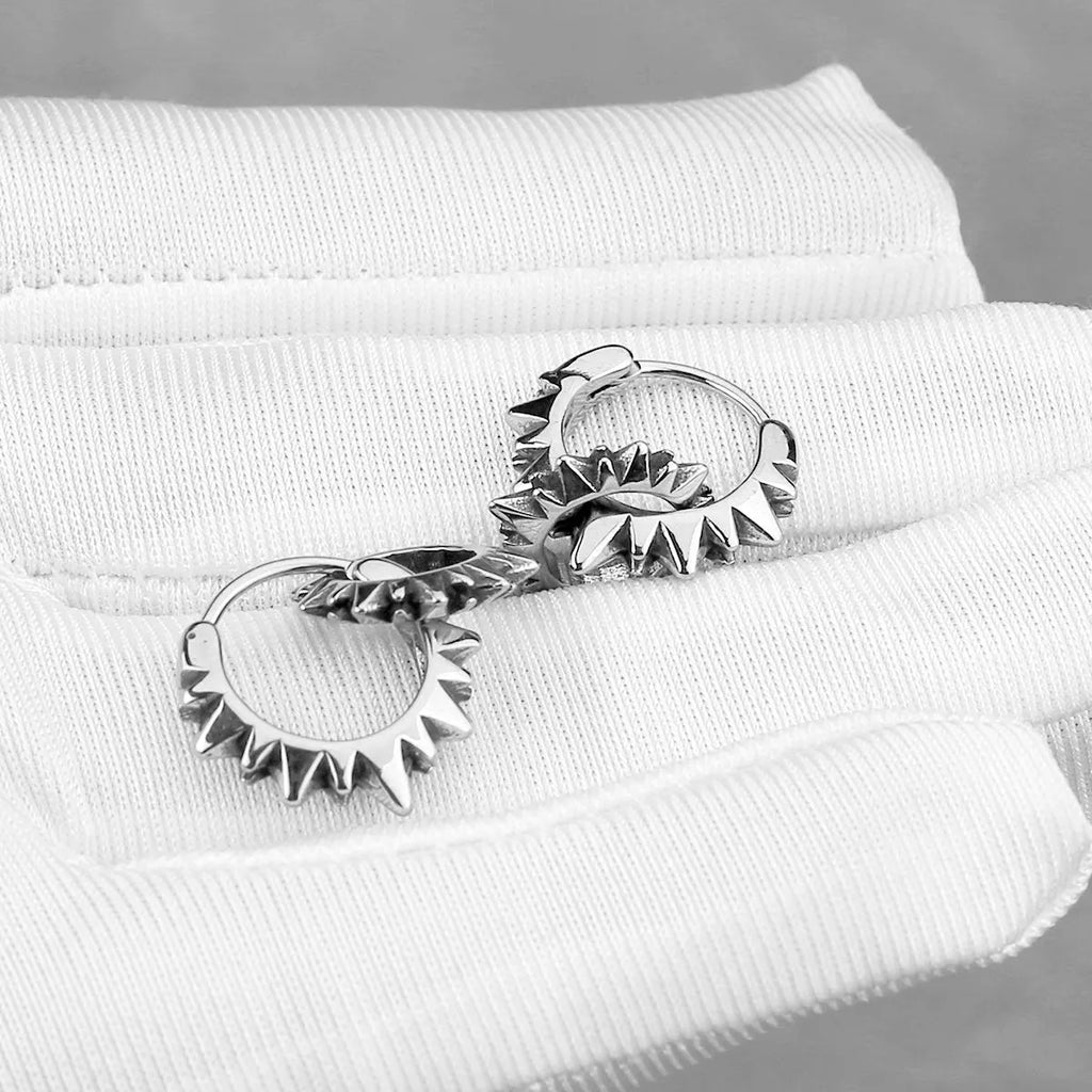 Stainless steel round ring earrings with polished steel finish and retro styling
