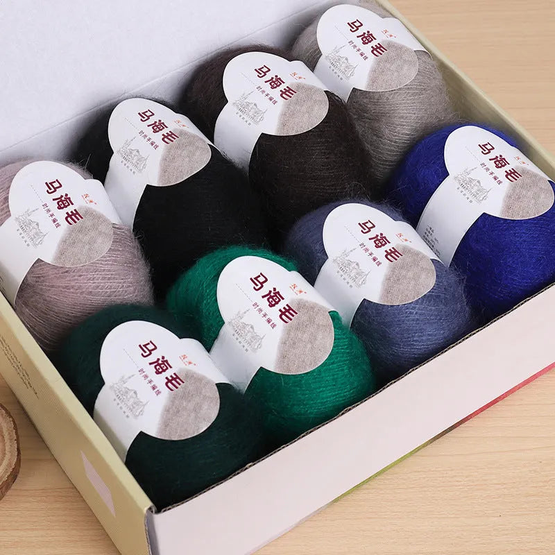 Mohair wool ball for DIY scarf knitting in assorted colours on white background