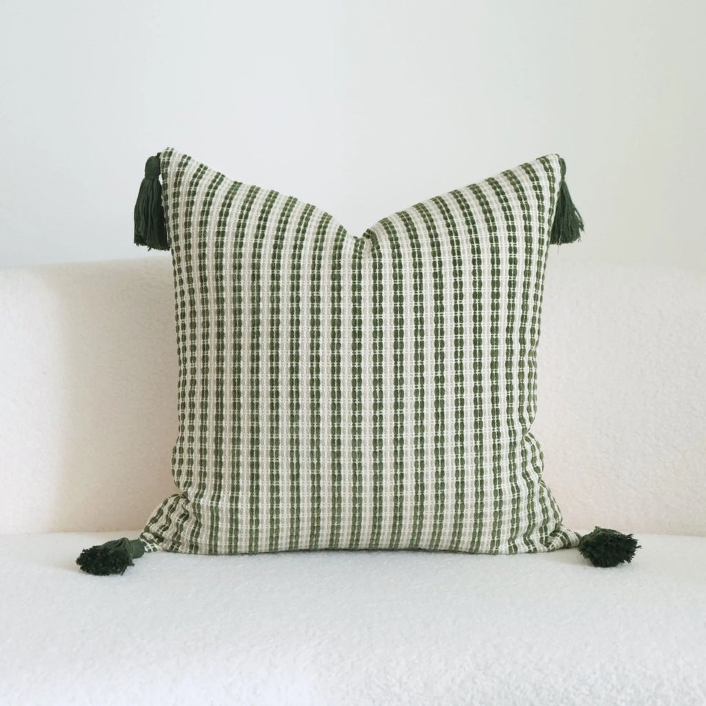 Green botanical patterned decorative pillows in striped, tree, and leaf designs on brushed cotton linen fabric