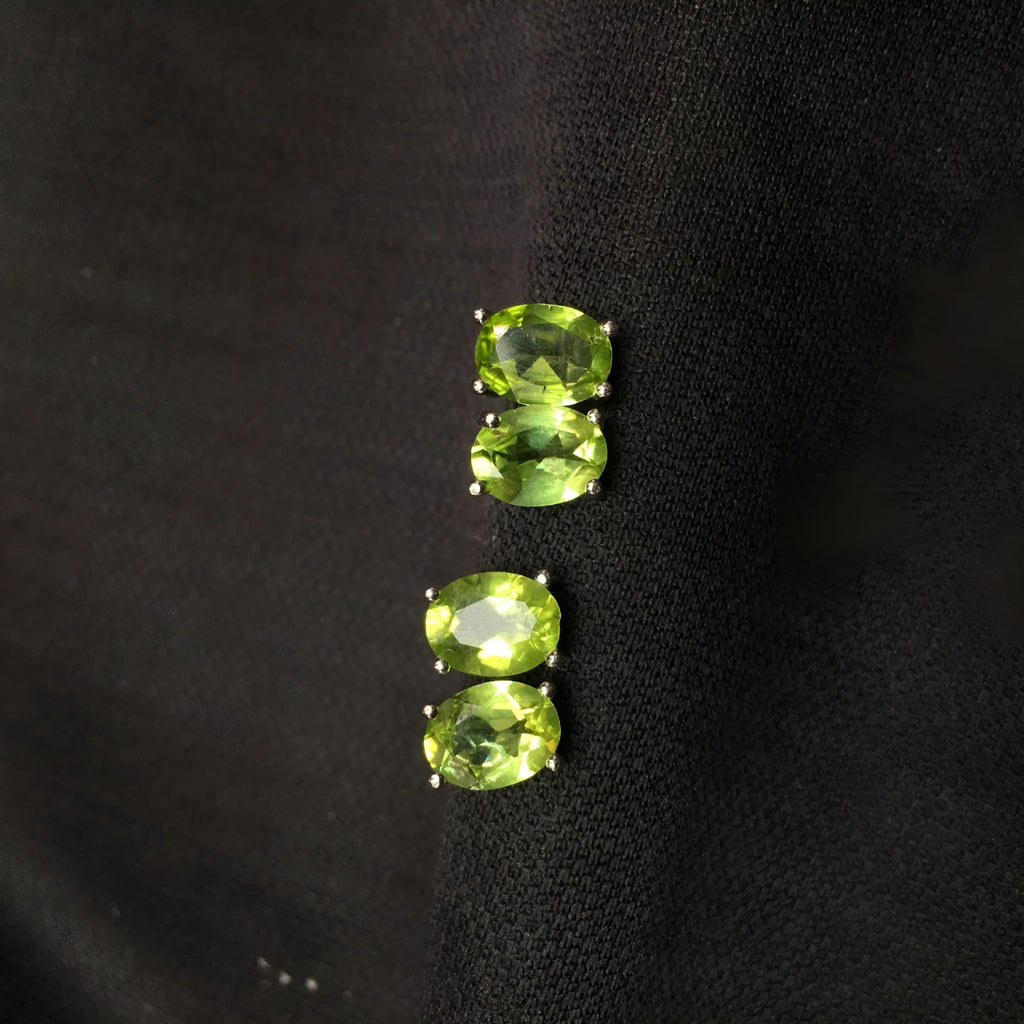 Natural olivine faceted stud earrings in S925 sterling silver with 6 × 8mm grass green oval stone