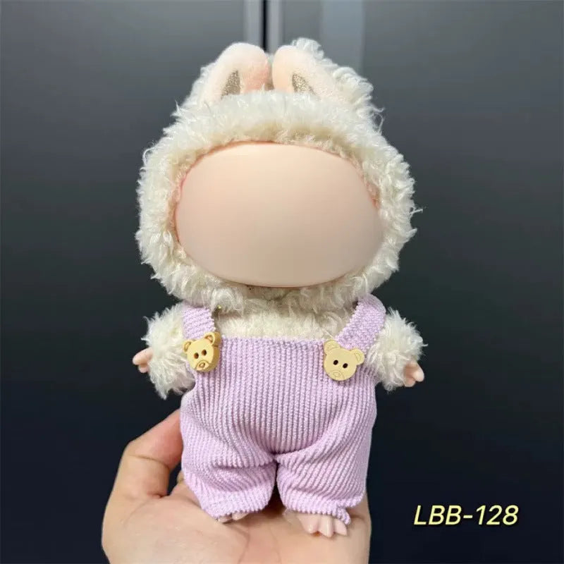 Plastic doll clothing costume for 17cm tall vinyl figurines on a display stand.