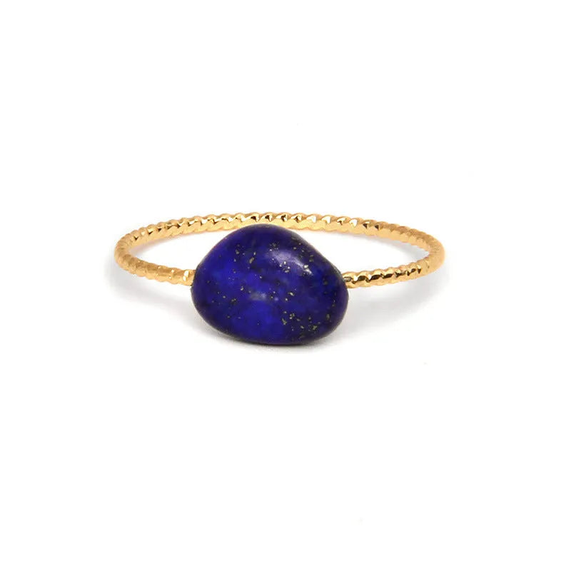 Original geometric women's agate ring on a hand, showing unique stone banding in one of eight colour options.