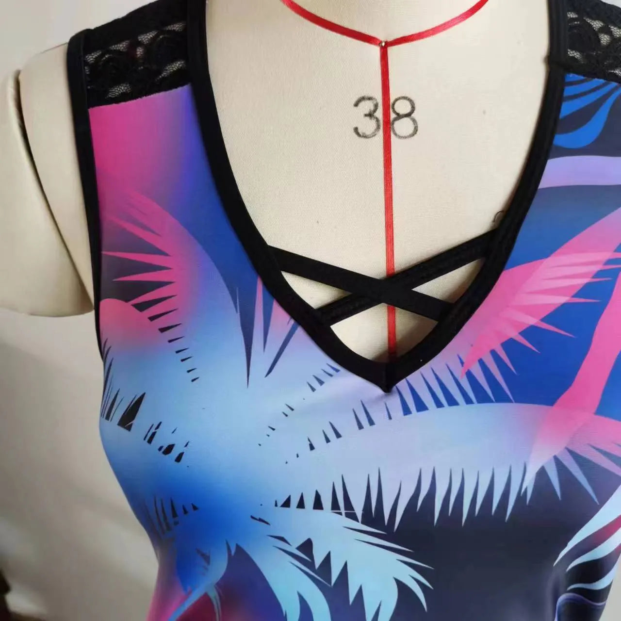 Women's blue printed lace two-piece swimsuit top and shorts laid flat.