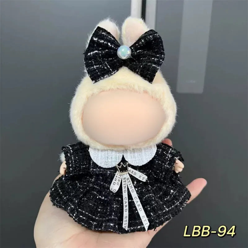 Plastic doll clothing costume for 17cm tall vinyl figurines on a display stand.