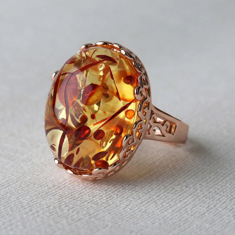 Amber ring with natural beeswax gemstone on adjustable alloy band