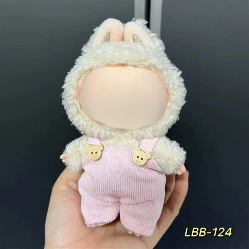 Plastic doll clothing costume for 17cm tall vinyl figurines on a display stand.