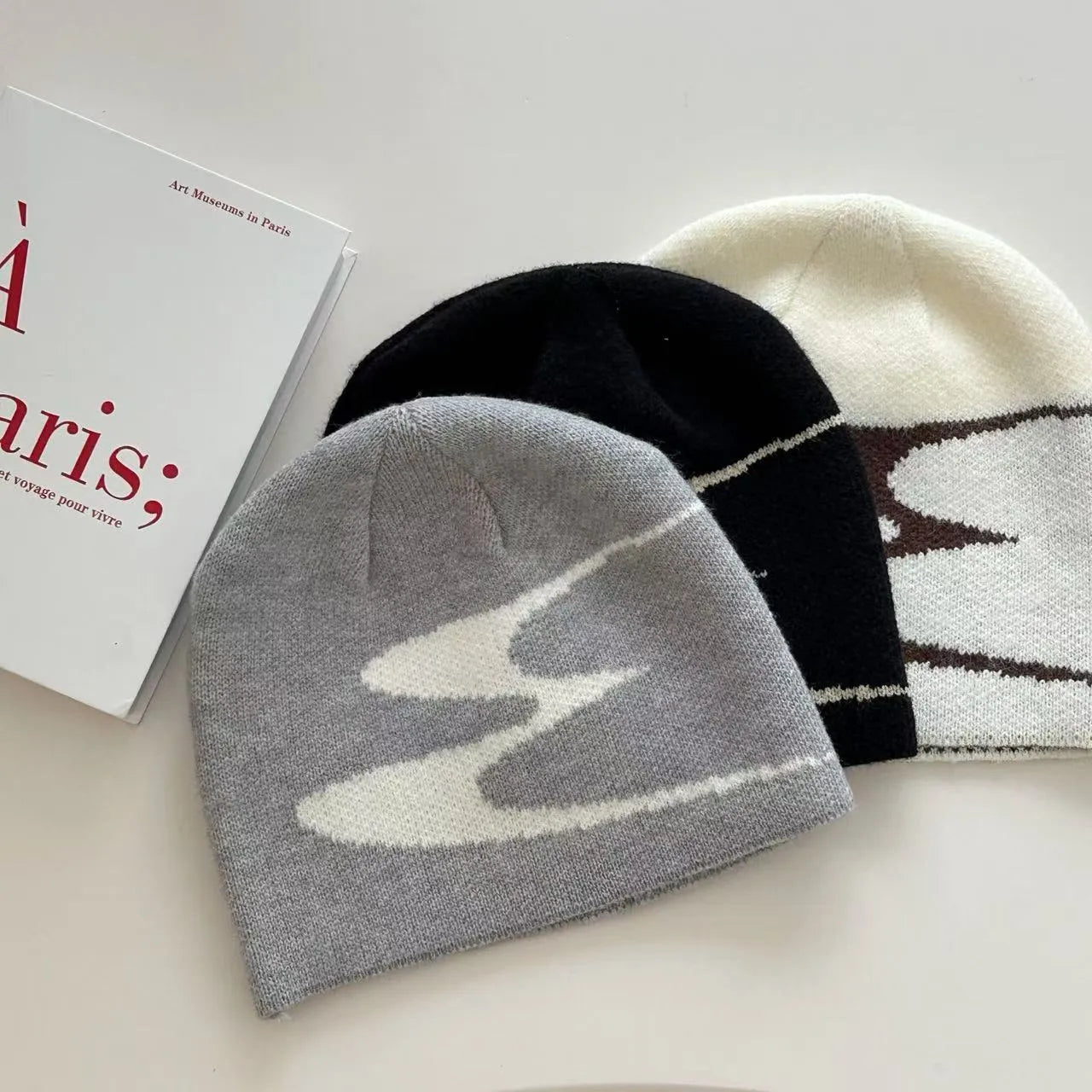 Acrylic knitted beanie hat for men and women in black, grey or white colours with thermal warmth