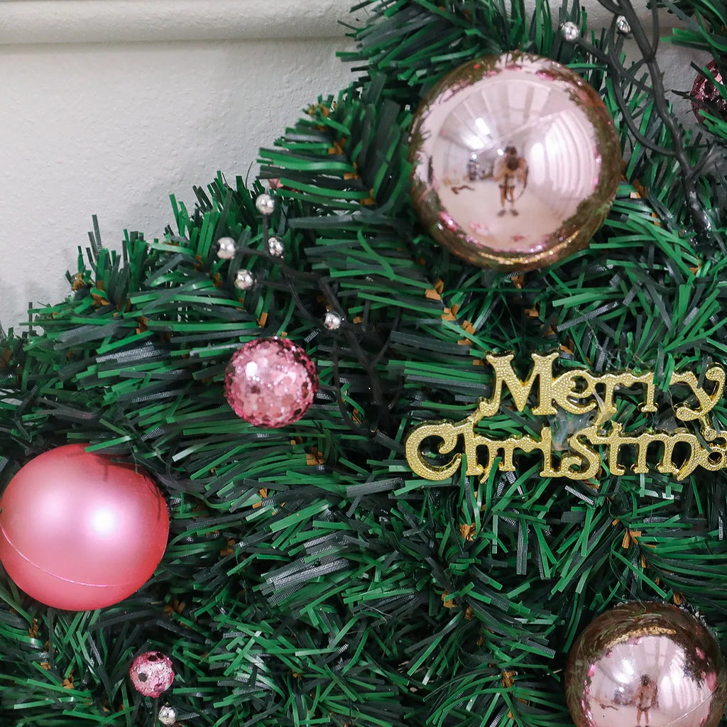 A 2.7-metre long pink Christmas rattan decoration with 240 small decorative heads, styled in a South Korea aesthetic.
