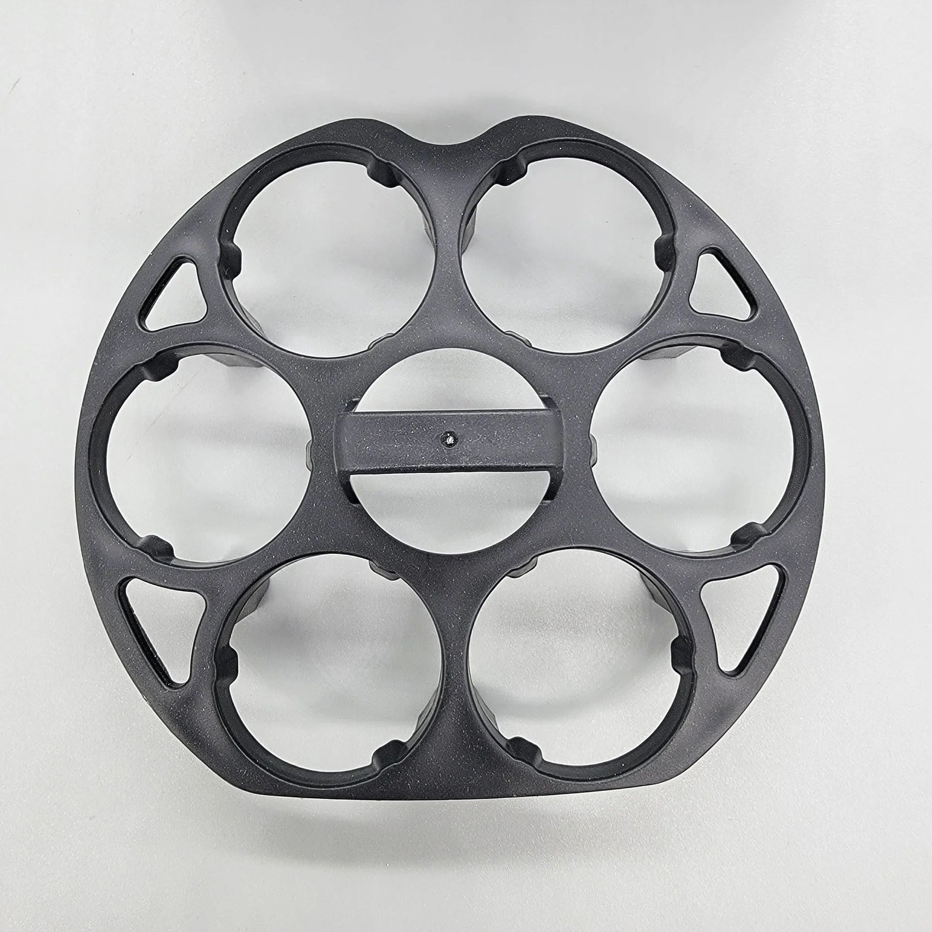 Black plastic egg holder basket for kitchen countertop storage.