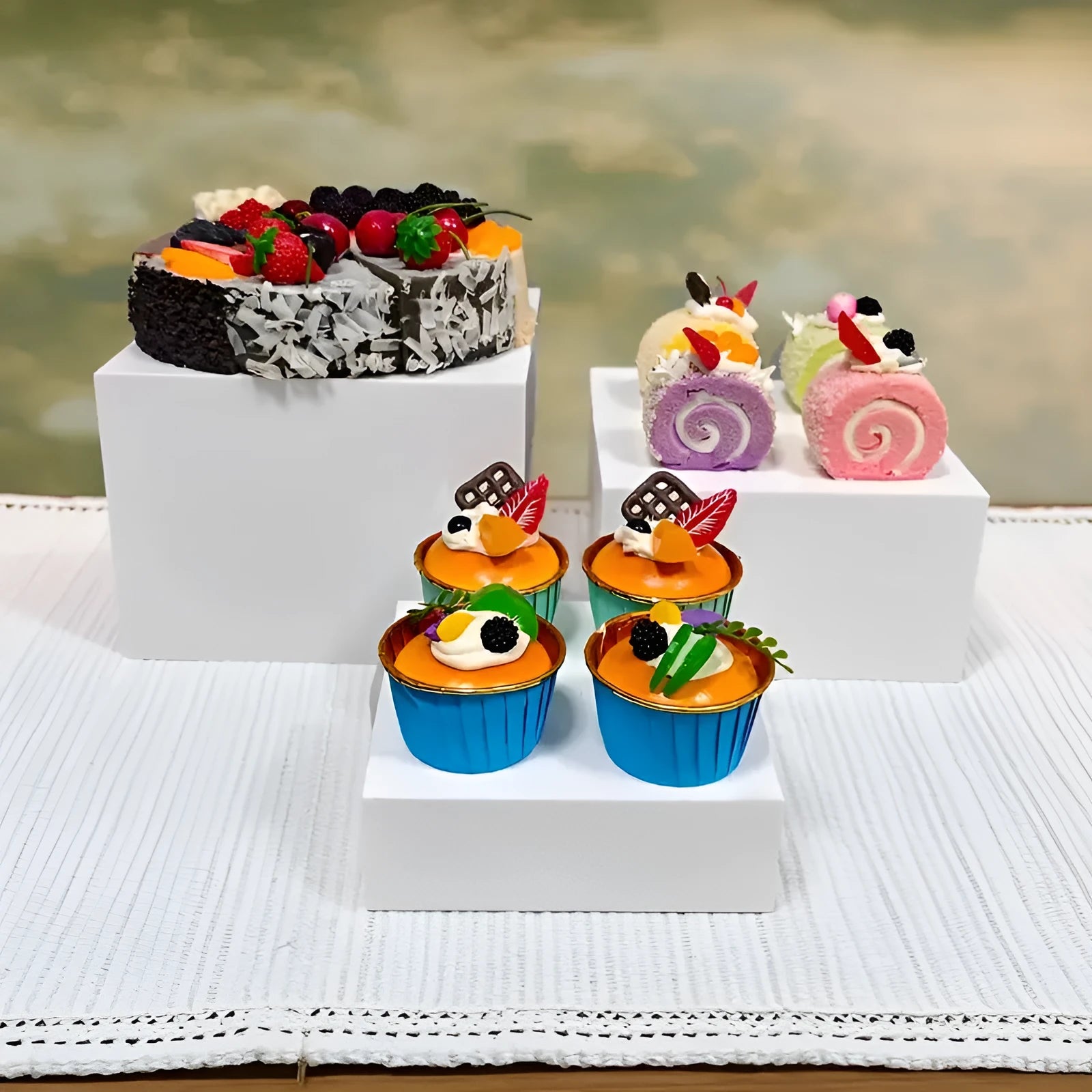 White plastic six-piece stacking dessert table display stand set for tiered bakery presentation