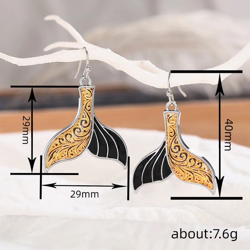 Women's white gold colour fishtail earrings with whale design