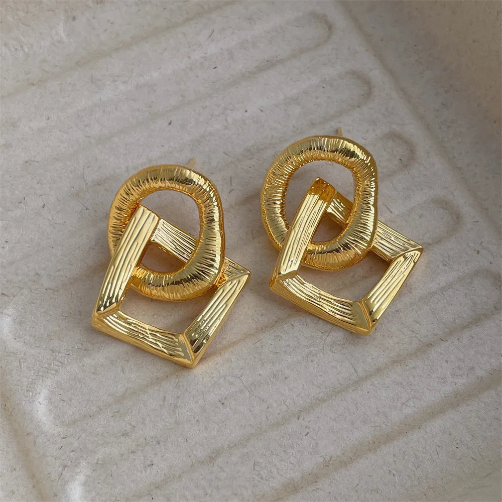 Geometric copper pendant earrings with 3.4cm drop and electroplated gold or silver finish