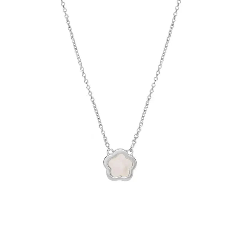 White mother shell flower necklace with floral pendant on gold or silver chain.