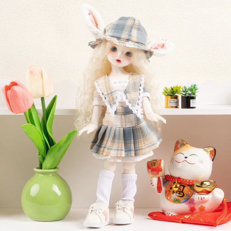 Printed cloth doll clothes for fashion dolls in various colourful patterns sold separately without dolls