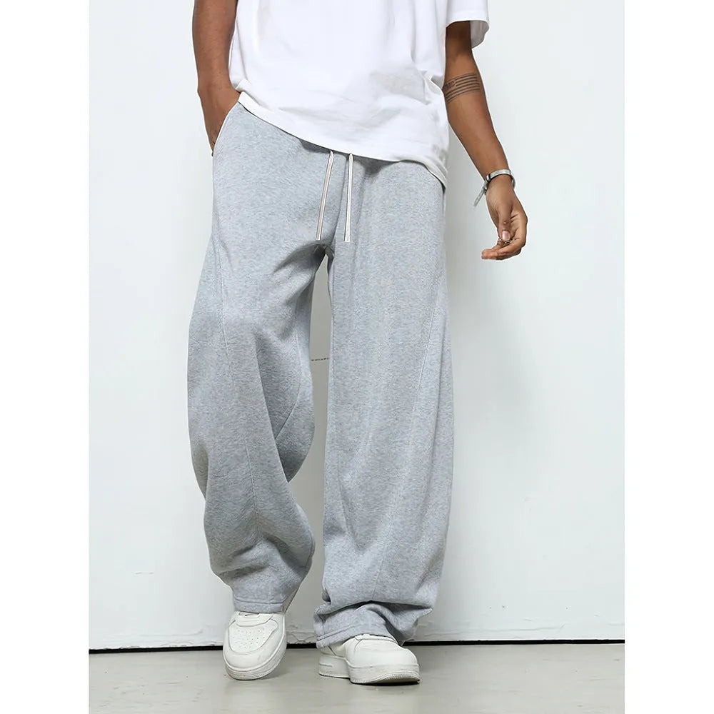 Men's solid-colour casual trousers with a drawstring waist in a straight-leg style.