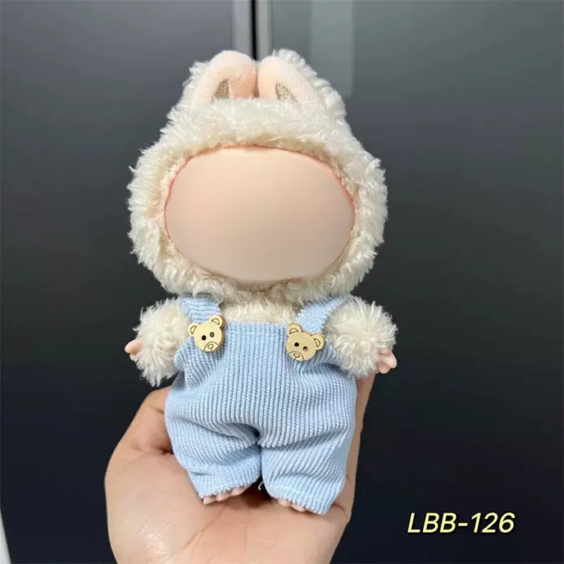 Plastic doll clothing costume for 17cm tall vinyl figurines on a display stand.