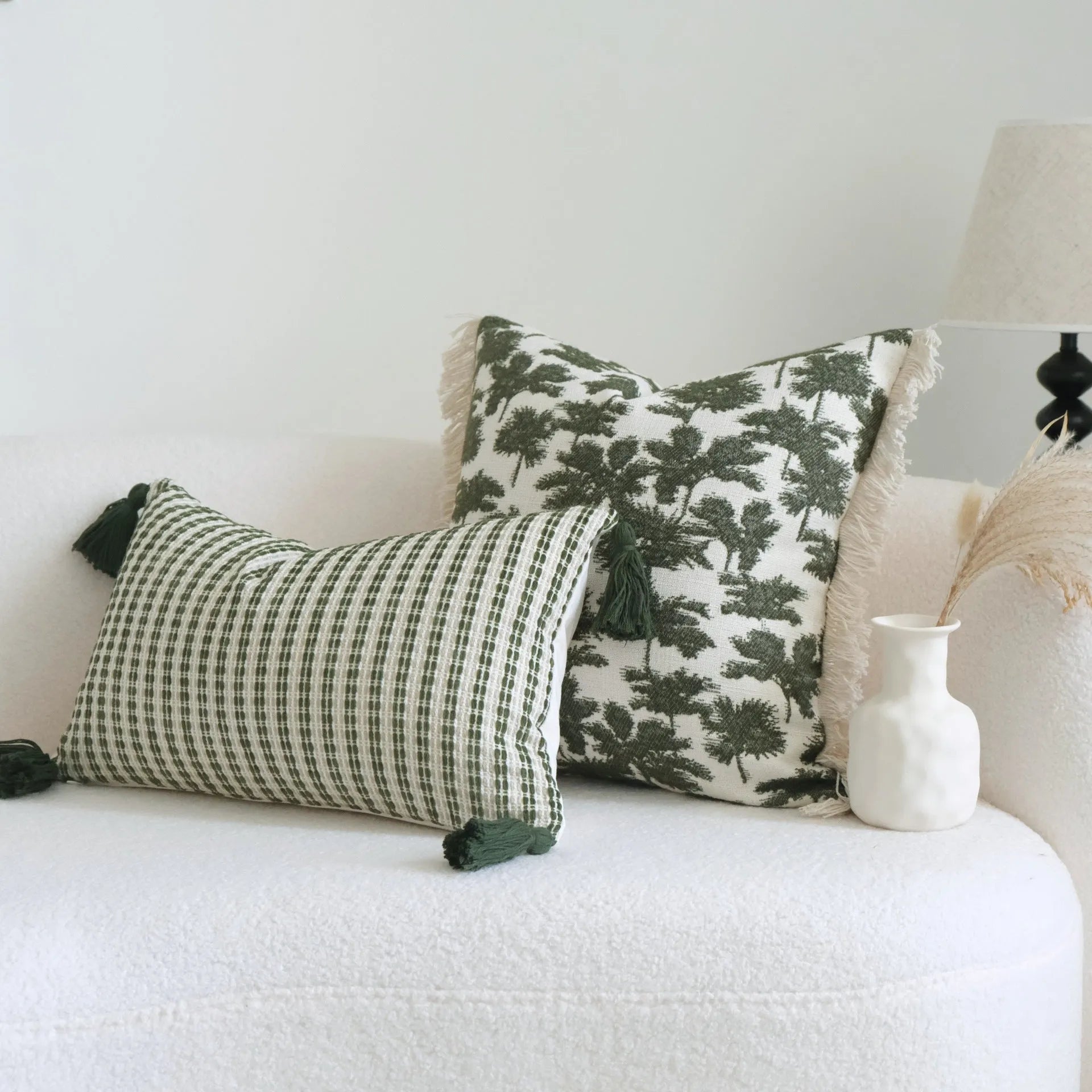 Green botanical patterned decorative pillows in striped, tree, and leaf designs on brushed cotton linen fabric