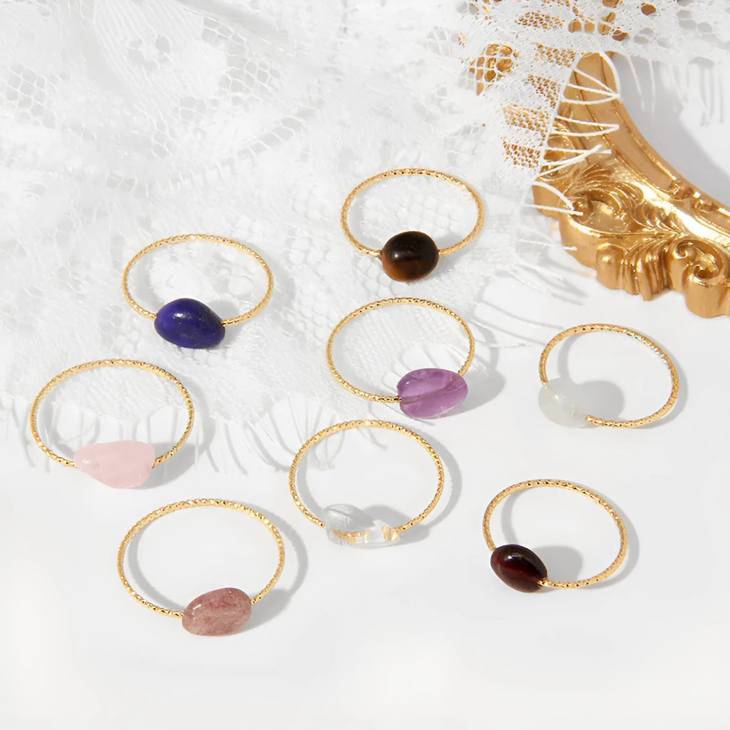 Original geometric women's agate ring on a hand, showing unique stone banding in one of eight colour options.