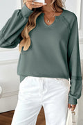 Women's loose-fitting long sleeve sweater with lace trim and a half-open collar in a solid colour.