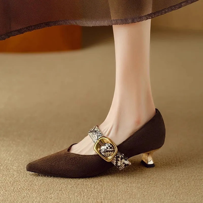 Women's black pointed toe stiletto high heels with a buckle strap on the instep