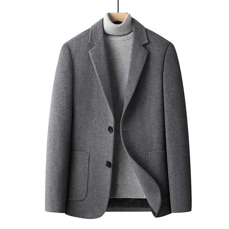 Men's slim-fit wool suit jacket in grey, shown on a hanger.