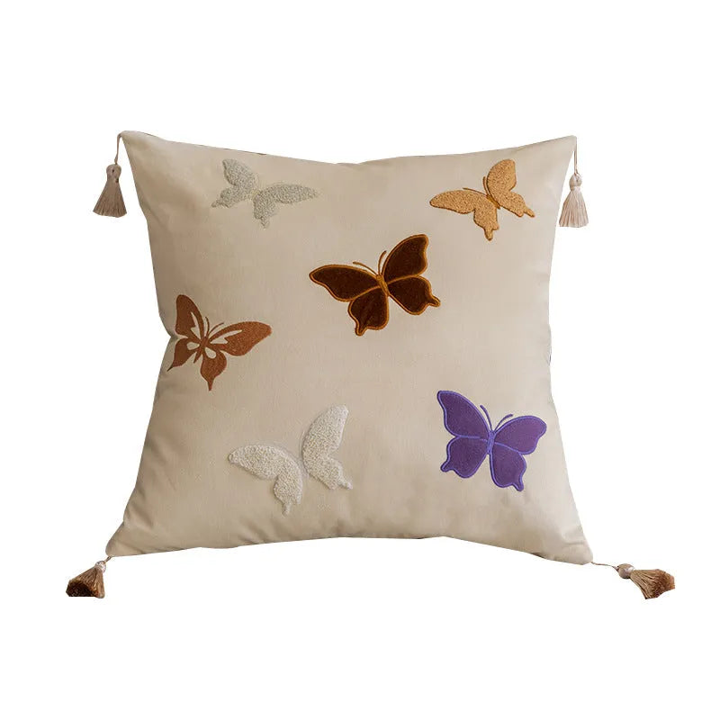 Square beige cushion with detailed black butterfly embroidery in a Chinese style pattern.