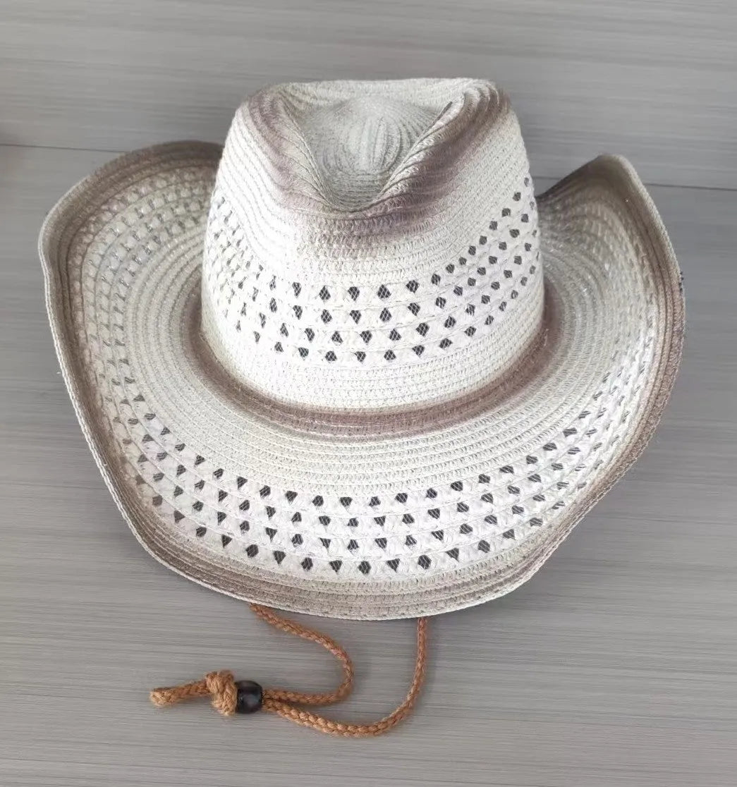 Brown leather velvet curved edge Western cowboy hat with a conical crown on a table.