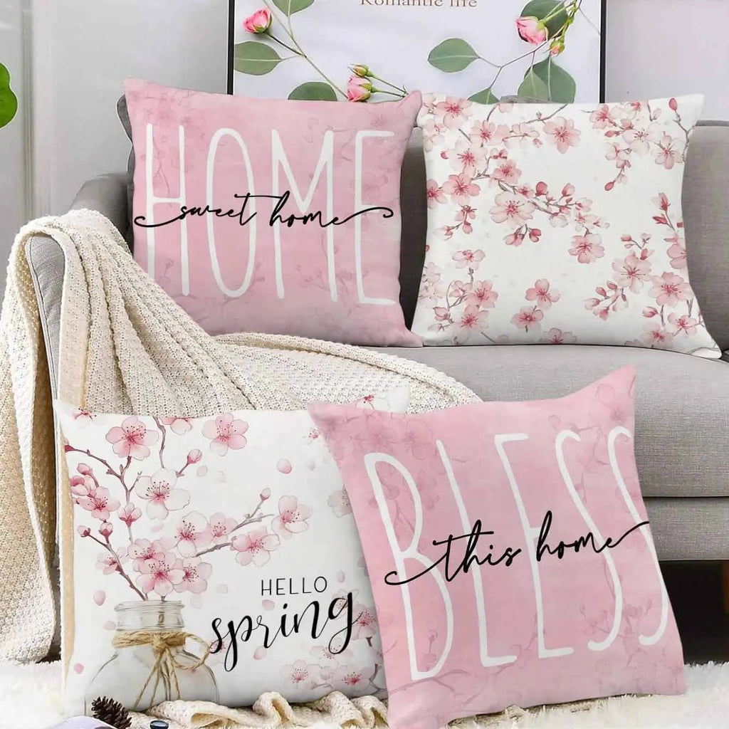 Short velvet cushion cover with cherry blossom letter print, 45cm square, shown in one of four colours.