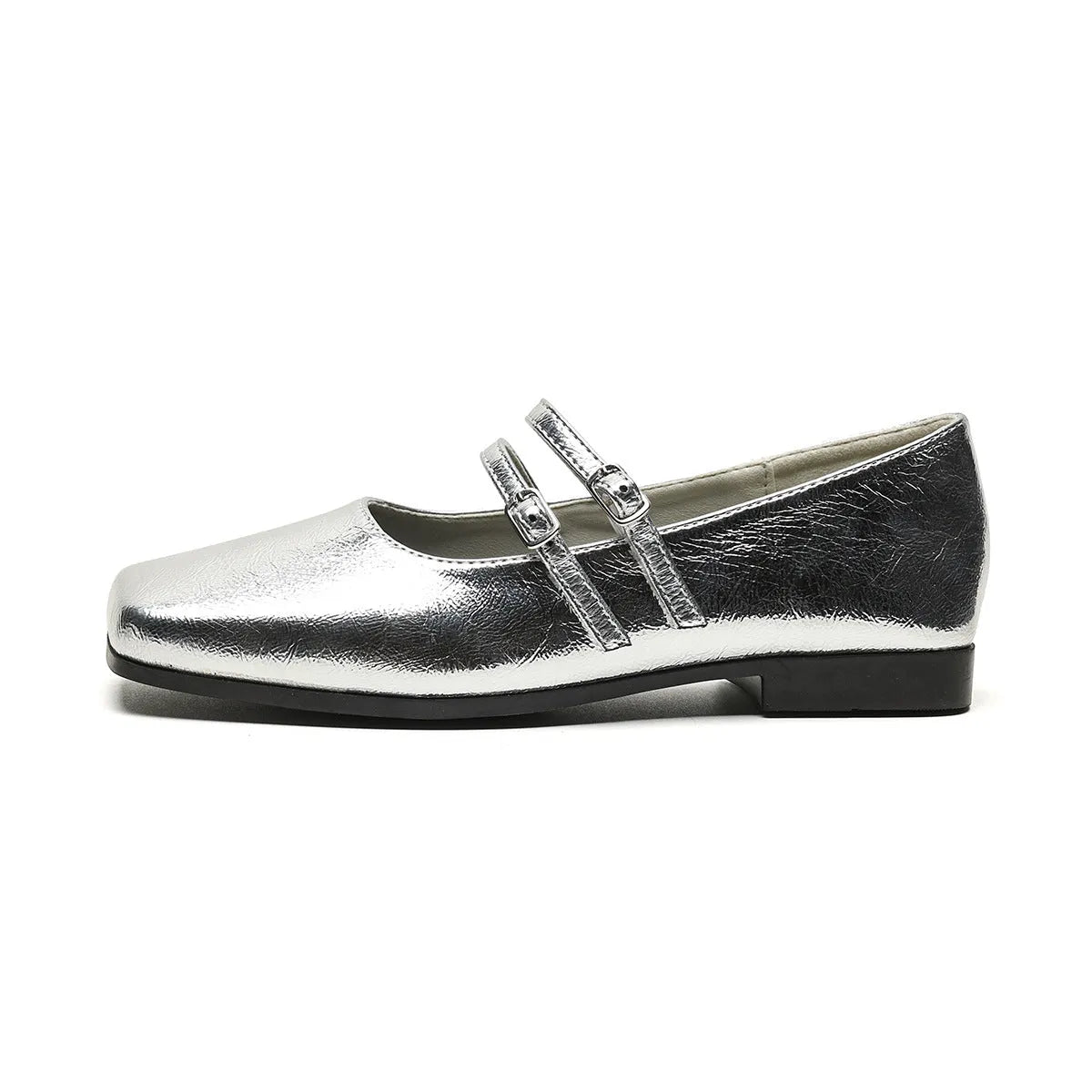 Women's silver leather Mary Jane flats with a cross buckle strap and flat sole.