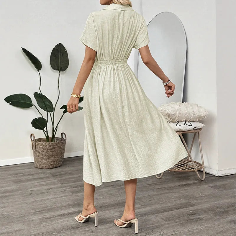 Light green women's shirtdress with lapel collar, waist tie, and side pockets.