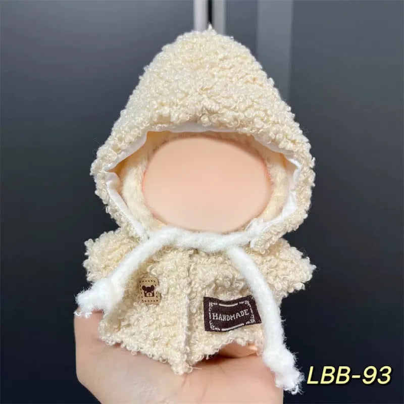 Plastic doll clothing costume for 17cm tall vinyl figurines on a display stand.
