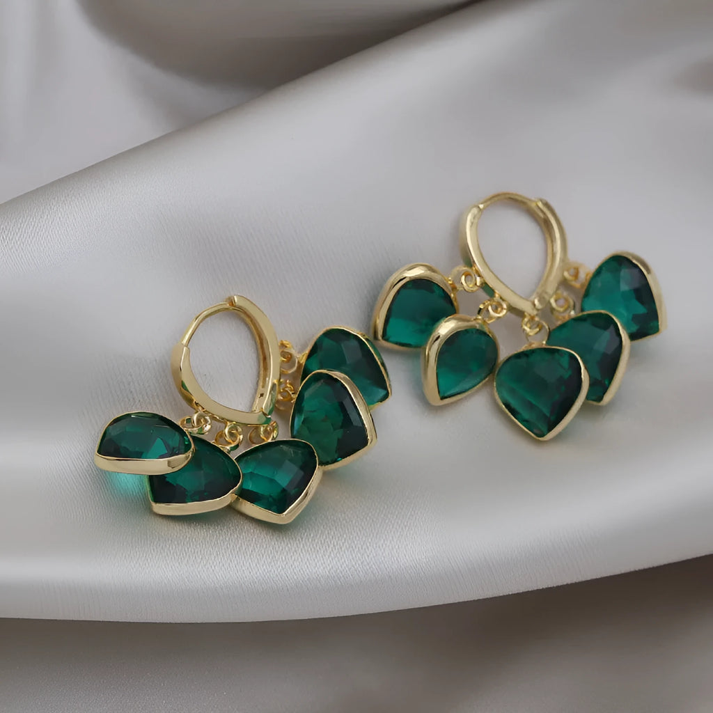 Pair of green heart-shaped pendant ear clips on a copper clip with Korean style design.